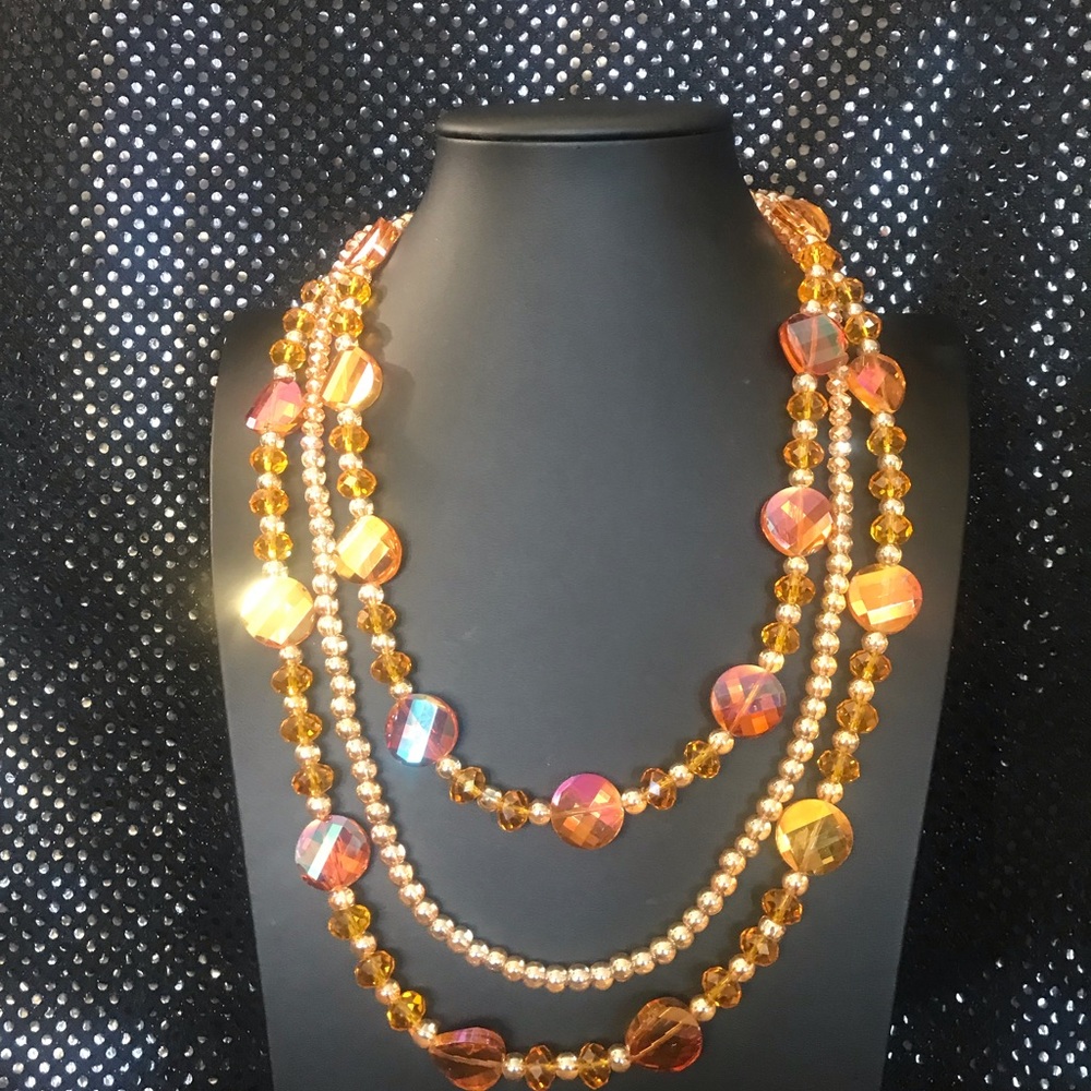 Burnt orange triple stranded beadedcnecklace and earring set